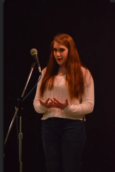 Student at poetry reading