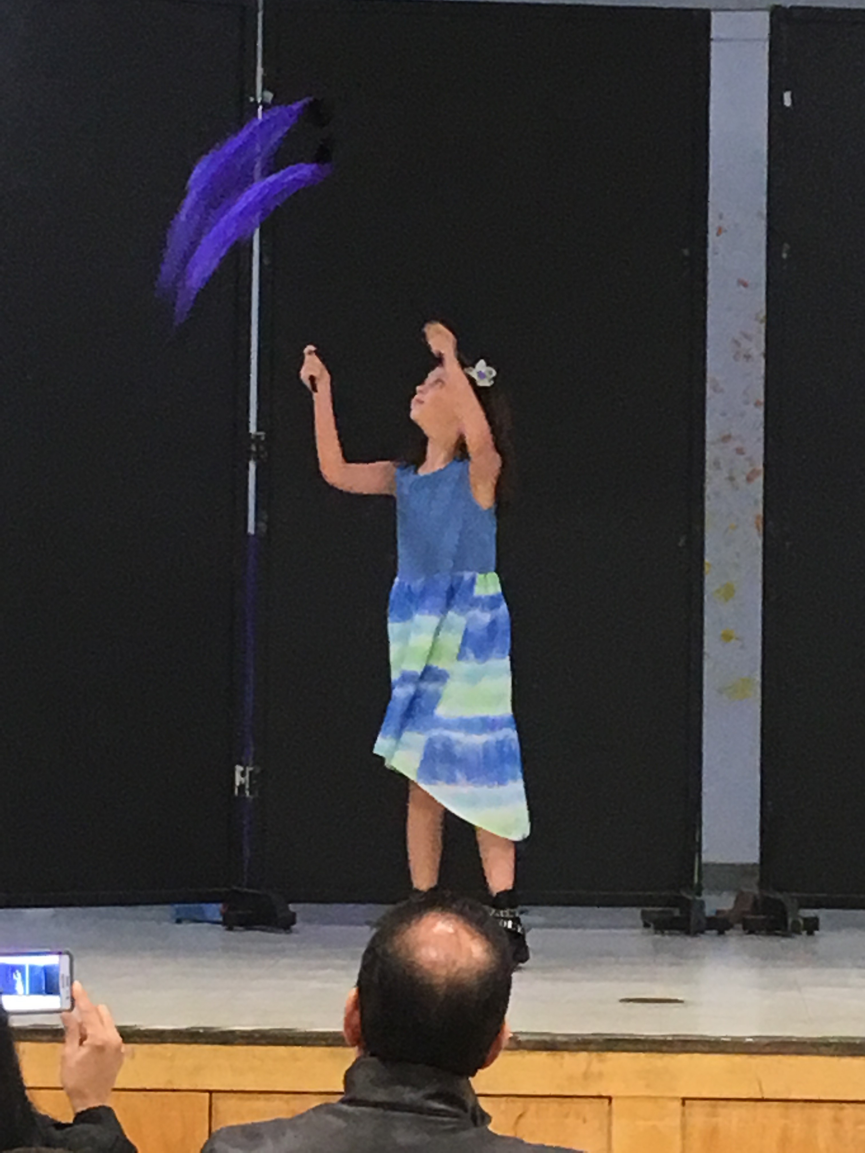 Student performing a ribbon dance